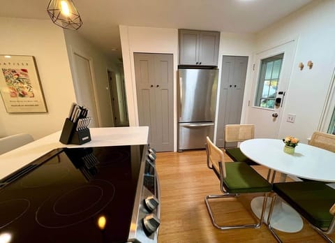 Full kitchen with fridge/freezer, dishwasher, microwave, range/oven