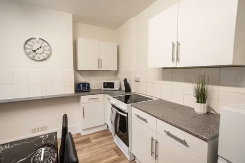 Full kitchen showing Microwave, Toaster, Hob and Oven