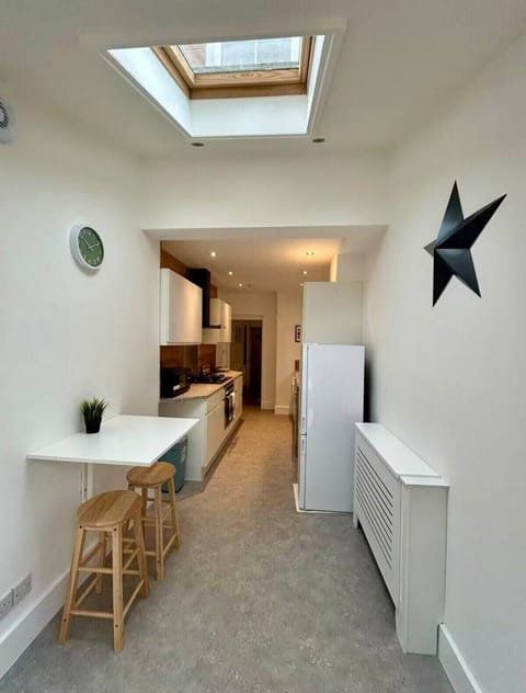 breakfast bar or work desk? Convenient power socket and coffee machine within easy reach