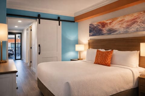 Drift off in a serene bedroom with warm, coastal style.