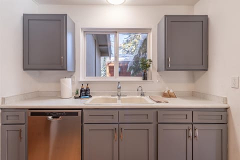Enjoy all the kitchen amenities including a dishwasher and provided soaps and sponges.