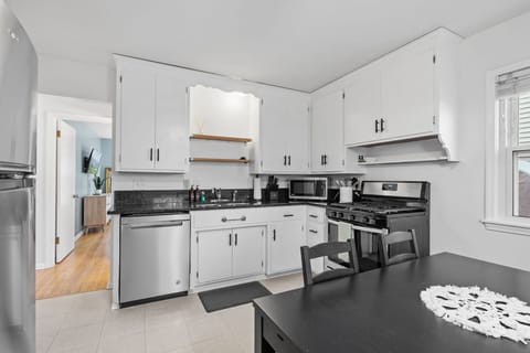 Your fully-equipped kitchen awaits with gleaming countertops, stainless appliances, and everything you need to create memorable meals during your stay.