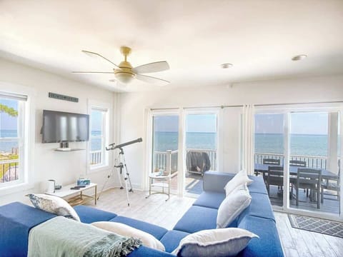 Airy living room w/ plush seating & coastal tones, perfect for unwinding after beach days.
