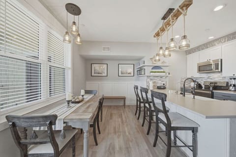 Dining area and eat at counter in open galley kitchen.