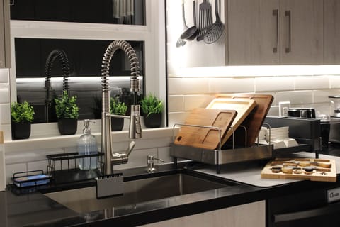 Dimmable LED string lights under both sides of kitchen.