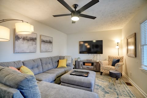 Living Room with comfy couch, smart TV and sofa sleeper