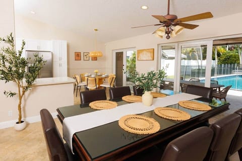 Our dining area features a large table perfect for family gatherings and holiday feasts. Additionally, there's a smaller table in a well-lit corner, ideal for casual meals or morning coffee.