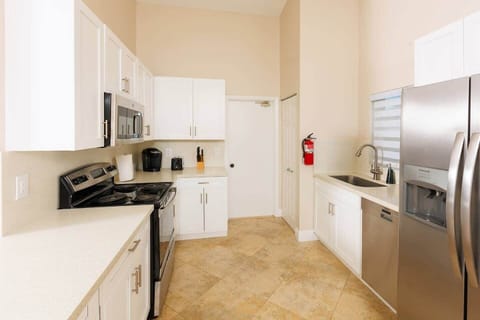 Our kitchen is filled with natural light and comes fully equipped with everything you need. Enjoy the convenience of a dishwasher, a full set of silverware, plates, and cups, as well as a coffee machine to start your mornings right.