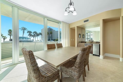 Gather around the elegant dining table, ready for memorable meals and conversations in this beautifully appointed bayfront condo.