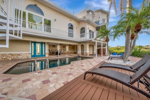 6000sqft Home with Room for 16 Guests Right on Palm Harbor with a Pool, Hot Tub, Private Dock, Boat Life, Pool Table, Projector, and so much more