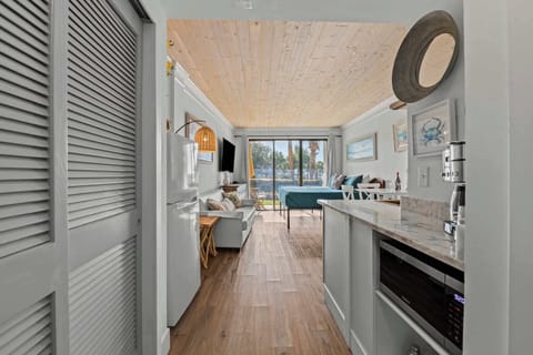 The studio’s open-concept layout maximizes natural light, creating a bright and welcoming space.
