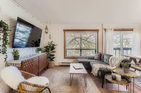 Comfortable boho-style living space with smart TV for daily use