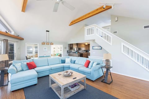 Top Level: Spacious Living Room w/ Vaulted Ceilings, Floor-to-Ceiling Windows, Fireplace, Smart TV, and Plush Sectional Seating