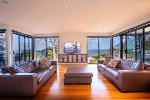 Expansive Living Area with Panoramic Ocean and Sunset Views