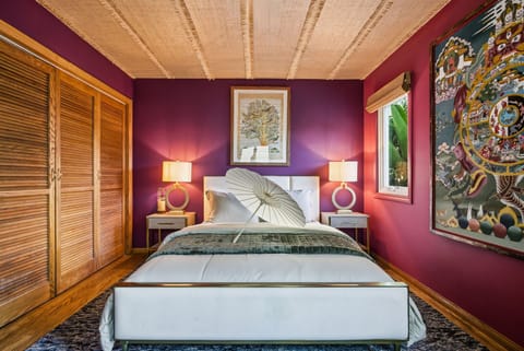A vibrant sanctuary designed for rest and inspiration. Soft lighting, bold colors, and curated art create a bedroom that feels both grounding and uplifting.