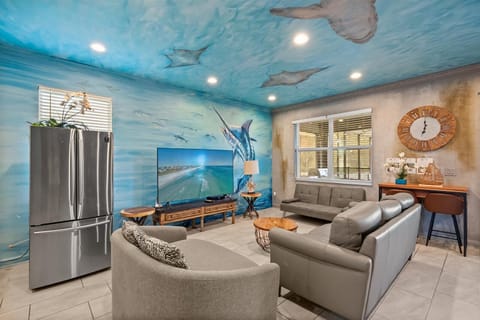 Cozy couches and beautiful mural paintings in the living room 