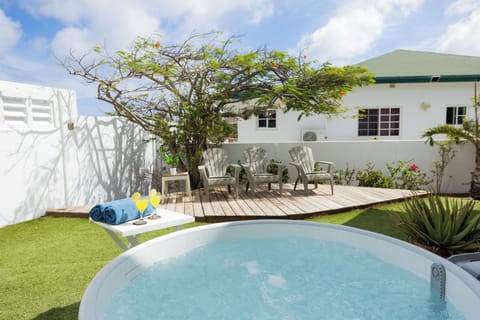 Relax in your private garden jacuzzi, comfortably suited for 2–3 guests. 