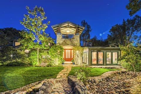 Welcome! Cross the bridge over the dry stream bed to our front entry.
