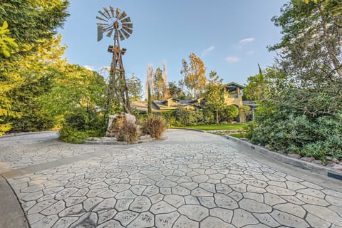 Authentic windmill with a cascading waterfall into the pond below