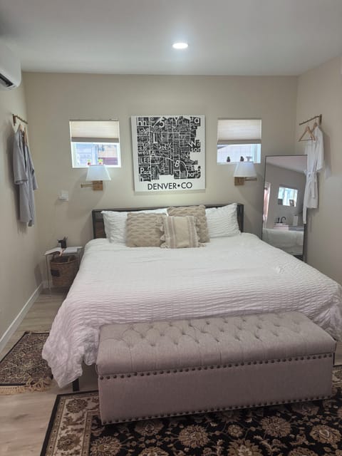 King bed with hotel linens, and robes for your comfort.  