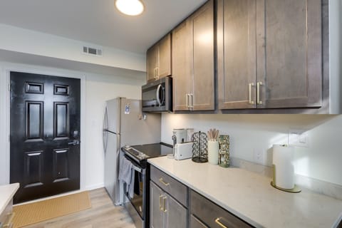 Modern kitchen design effects, gold tone fixtures, soft close cabinets & drawers