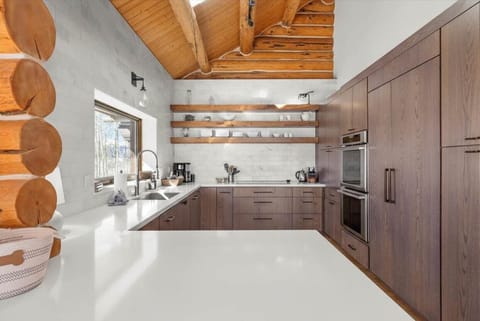 Kitchen: Drip coffee maker, toaster oven, kettle, cooking utensils, tableware