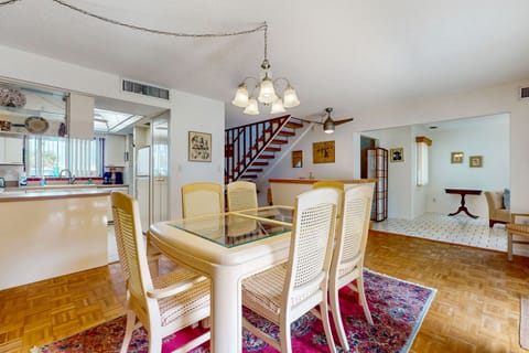 This open dining and living area creates an inviting setting for your beach stay. With spacious seating and a flowing layout, it's perfect for shared meals, relaxing evenings, and reconnecting after a day at the beach.
