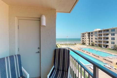 Enjoy a relaxing beach stay from this private balcony with ocean views, resort-style pool, and coastal breeze. Perfect for morning coffee or sunset unwinding just steps from the sand and surf.