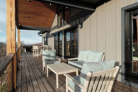 Enjoy fresh mountain air on the expansive deck with plenty of seating for morning coffee, outdoor meals, or wine at sunset. A peaceful gathering space surrounded by High Country scenery.