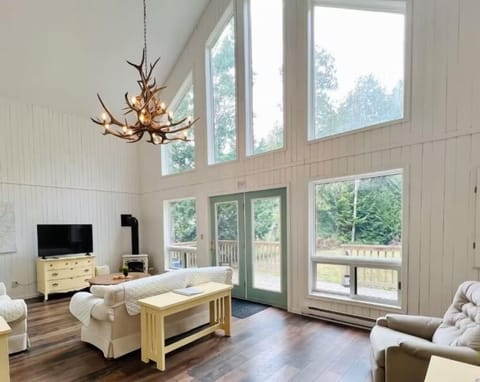 The heart of the cottage — open, sunlit, and inviting. Whether reading by the fire or enjoying a quiet morning, this is a space to slow down and reconnect.