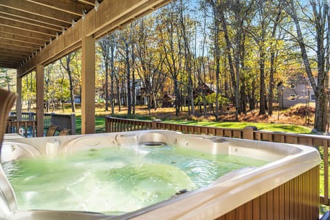 Unwind in the private outdoor hot tub, surrounded by peaceful woods and fresh mountain air—perfect for relaxing after a day of adventure.
