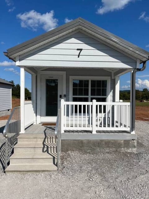 A charming front patio that offers a peaceful spot to sit back, take in the fresh air, and enjoy quiet moments outdoors. Perfect for morning coffee, evening unwinding, or simply relaxing between adventures.