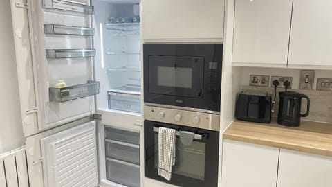 Large fridge/freezer. Integrated oven and microwave