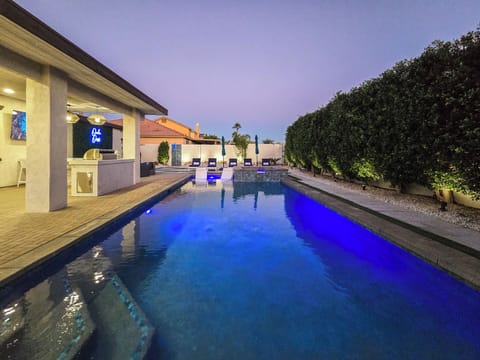 Resort style backyard-pool, spa, poolside and in-pool loungers and umbrellas