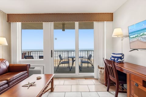 Relax in this bright oceanfront condo featuring a private balcony with sweeping beach views. Enjoy the ultimate beach stay with coastal décor, comfortable living space, and direct views of the waves—perfect for a peaceful seaside getaway.