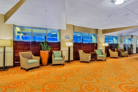 Relax in this comfortable resort lobby lounge during your beach stay. Featuring cozy seating and a welcoming atmosphere, it's the perfect spot to unwind, socialize, or take a break after a day enjoying the beach and pool.