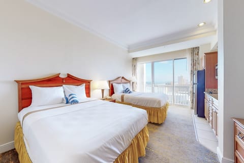 Cozy beach stay featuring two queen beds, sunny coastal décor, and beautiful high-rise views. Enjoy comfort and convenience with an in-room kitchenette and easy access to the shoreline. Perfect for your ocean getaway!