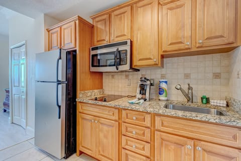 This efficient beach-stay kitchen features granite counters, stainless appliances, and all the essentials—ideal for preparing quick meals and snacks during your coastal getaway.