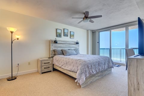 Wake up to ocean views in this inviting oceanfront bedroom featuring a comfortable bed and private balcony access. Perfect for relaxing beach stays with soothing sounds of the waves just outside.