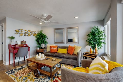 Inviting coastal living room with plush seating, beach-inspired décor, and natural light. Unwind after a day at the shore in this comfortable beach stay, perfect for relaxing, gathering, and enjoying a seaside vacation retreat.