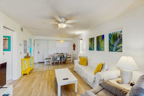 Enjoy a relaxing beach stay in this bright coastal condo featuring tropical décor, open living and dining space, comfy seating, and island-inspired accents—perfect for unwinding after a day in the sun and sand.