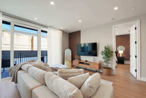 Bright open living area w/ comfy seating and plenty of space to relax together.
