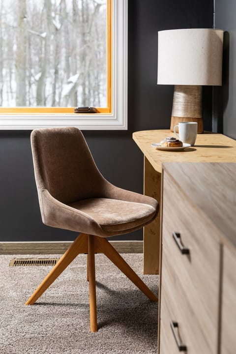 The work space in the master bedroom is a cozy spot to get some work done while enjoying the view of woods out back.