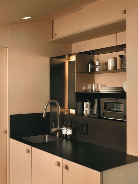 A compact, well-equipped kitchenette with everything you need for simple meals and slow mornings. Thoughtful touches throughout make the small space feel effortless.