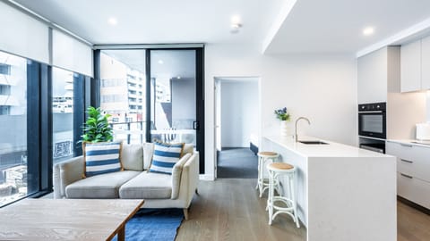 Bright and airy open-plan living and kitchen area with modern finishes.