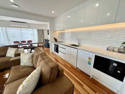 Modern open kitchen with full appliances and easy flow to the living area.