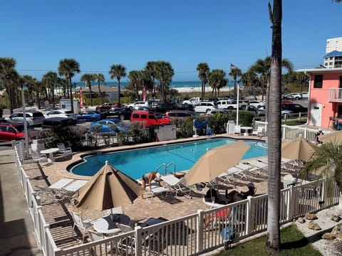 The heated pool is in front of the next building to the South.