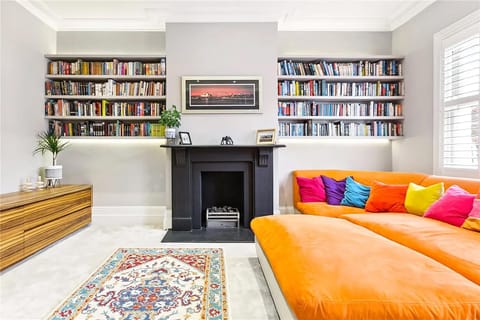 Sink into the oversized sofa in the reading room, where a wall of books and cosy fireplace invite you to relax.