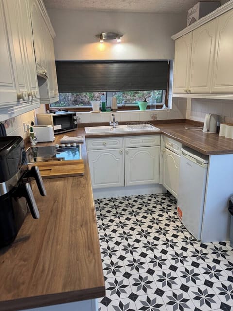 Bright & Functional Kitchen – Cook with ease in a clean, well-organized space.