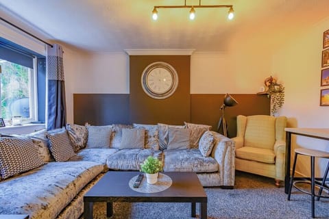 Bright and comfortable living area with plenty of natural light – perfect for relaxing after a long day.